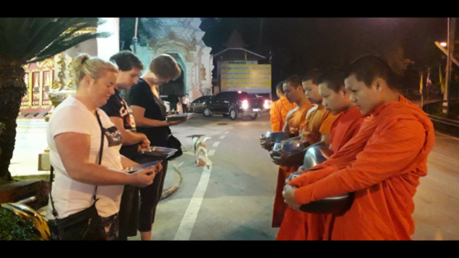 our small group giving our offering to local monks and receiving their blessings in Sanskrit chant