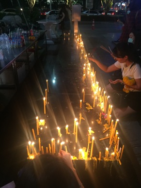 lighting candles for prayers