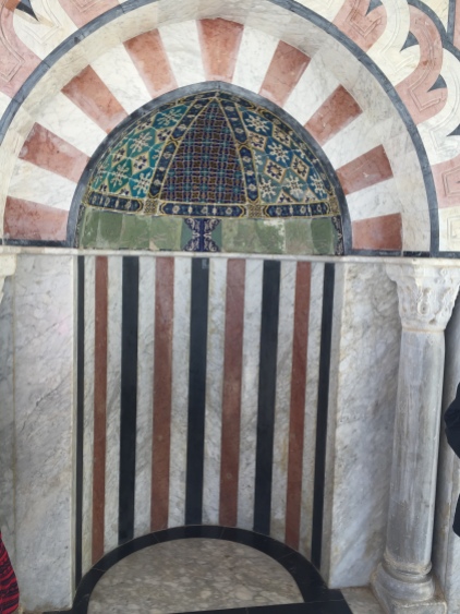 This niche in the wall in a mosque indicates which direction to pray towards